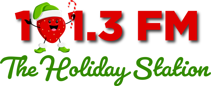 The Holiday Station logo featuring a cartoon strawberry wearing a green Santa hat and holding a candy cane