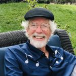 An older man with white beard and mustache. The host of the Echoes Of Jazz radio show.