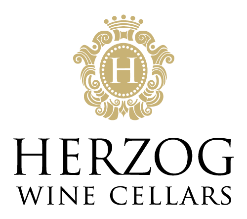 The Herzog Wine Cellars' logo featuring a regal gold seal with a capital H in the center. There's fancy filigree framing it. The words Herzog Wine Cellars appear under the seal.